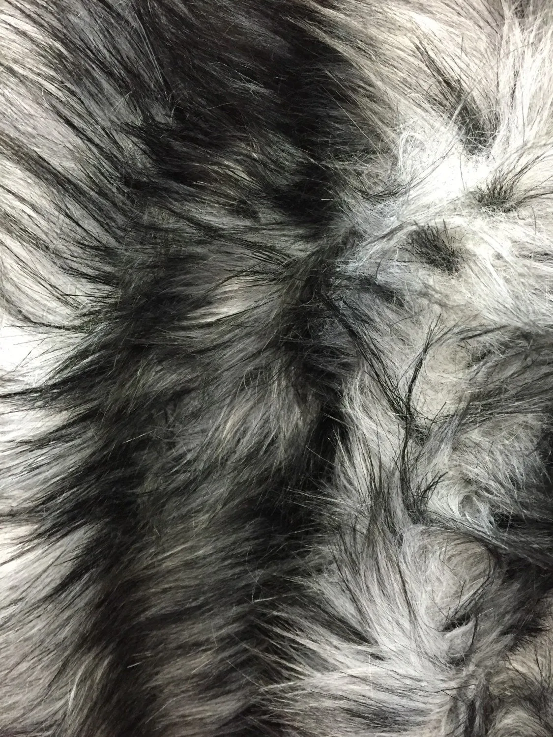 Gray/black husky faux fur, 2 tone shaggy faux fur. Sold by the yard.60" wide.