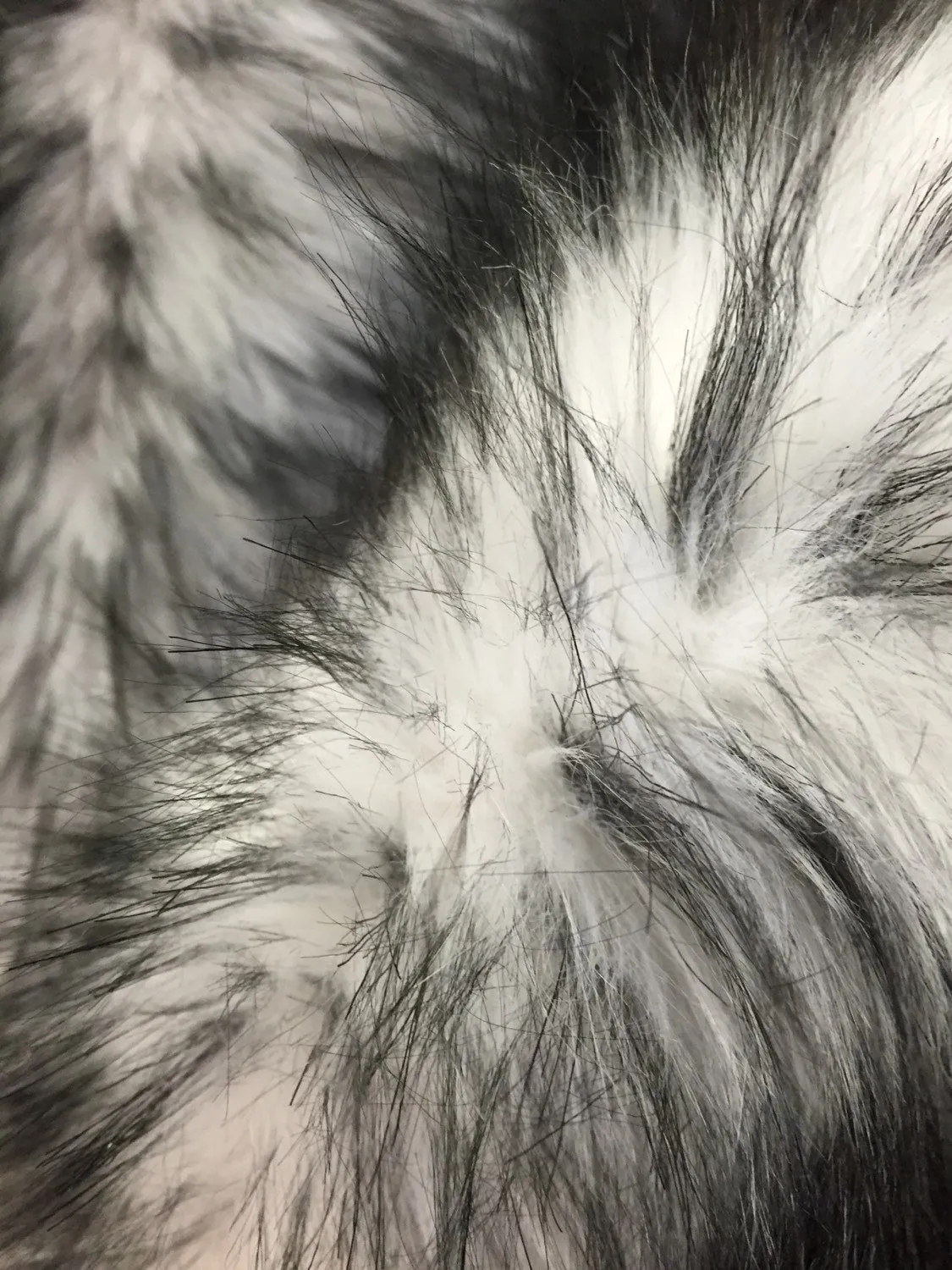 White/black husky faux fur, 2 tone shaggy faux fur. Sold by the yard.60" wide.